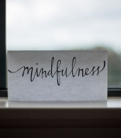The word mindfulness in script