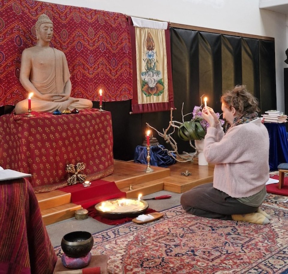 Suvarnadhi making an offering during puja (ABC)