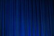 Blue theatre curtains (Unsplash)