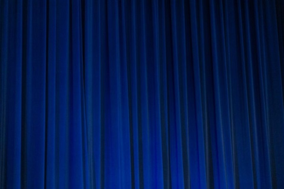 Blue theatre curtains (Unsplash)