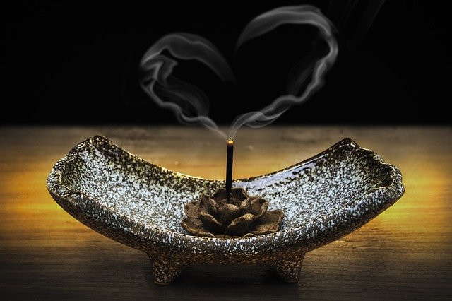 Incense smoke forming the shape of a heart