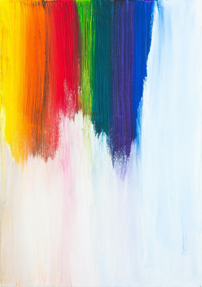 Rainbow of paint stripes on a white canvas