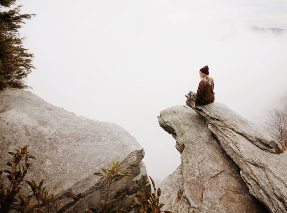 Woman Sitting on Rock - cropped