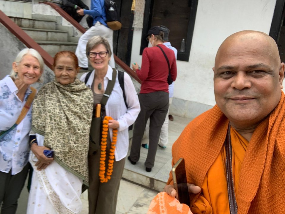 Monk with selfie of Jane and friends
