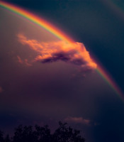 Brilliant rainbow amidst a dark stormy sky