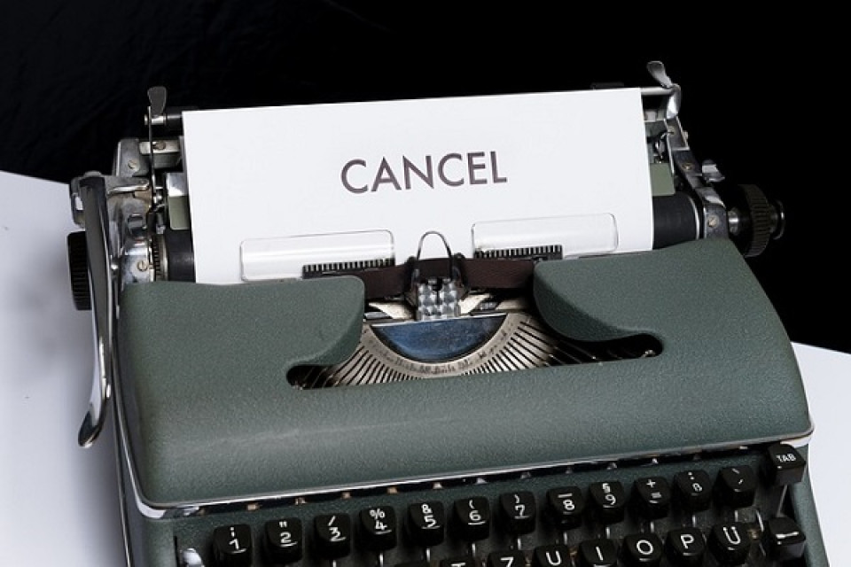 Piece of paper with the word cancel on it in a typewriter
